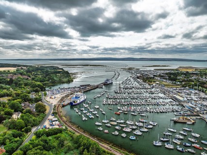 Wight Light car ferry to Isle of Wight on Lymington River and marina from drone, Lymington, New