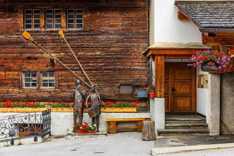 Copper sculptures of drummers and pipers, Saint Luc town house, Val d'Anniviers, Valais Alps,