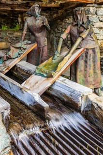 Copper sculptures of two washerwomen at the historic washing place, Saint Luc, Val d'Anniviers,