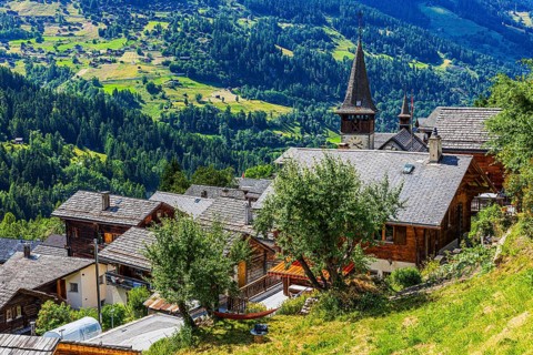 Houses with wooden shingle roofs, behind the church of Saint Anna, Ayer, Val d'Anniviers, Valais