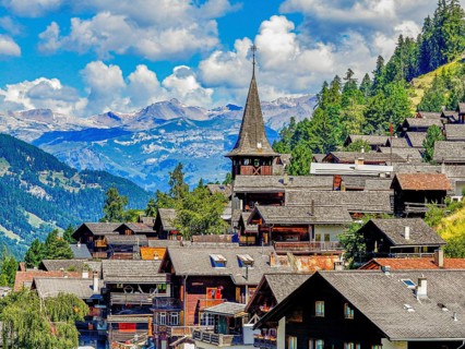 The mountain village of Ayer with the church of Saint Anna, drone image, Val d'Anniviers, Valais