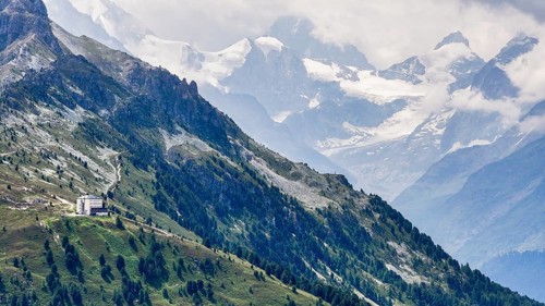 The historic Hotel Weisshorn below the Weisshorn mountain, behind the four-thousand-metre peaks and