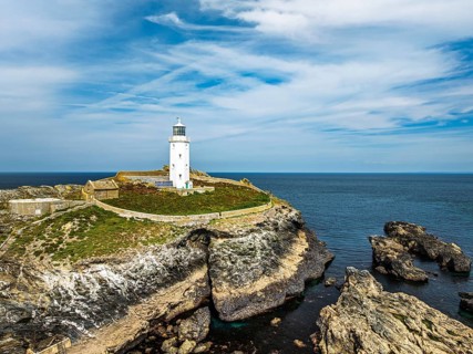 Godrevy Lighthouse from a drone, Godrevy Island, St Ives Bay, Cornwall, England, United Kingdom