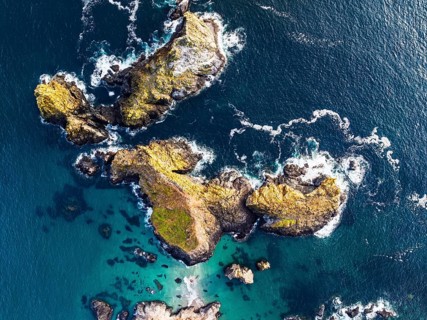 Top Down view over Kynance Cove from a drone, Mount's Bay, Lizard Point, Cornwall, England, United