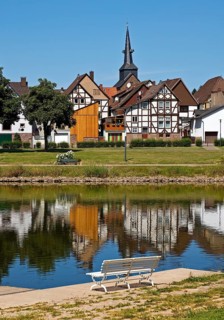 View over the river Weser to the old town centre of Bodenwerder with the church tower of St.
