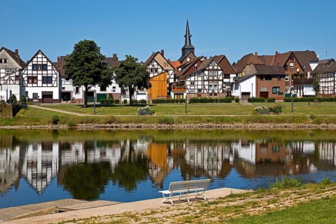 View over the river Weser to the old town centre of Bodenwerder with the church tower of St.