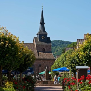 Pedestrian zone to the Protestant town church of St Nicolai in the Münchhausen town of Bodenwerder,