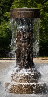 Fountain of Knowledge by Heinrich Jobst in the large spa gardens of Bad Nauheim, Hesse, Germany