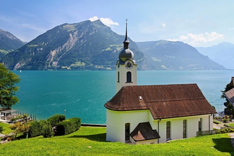 Roman Catholic Church of St Idda, Lake Lucerne in the background, Bauen, Canton, Uri, Switzerland