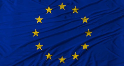 Close up of European Union flag waving. Flag of European Union with cloth texture