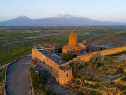 Historical monastery at sunrise with a view of Mount Ararat, aerial view, Chor Wirap monastery,