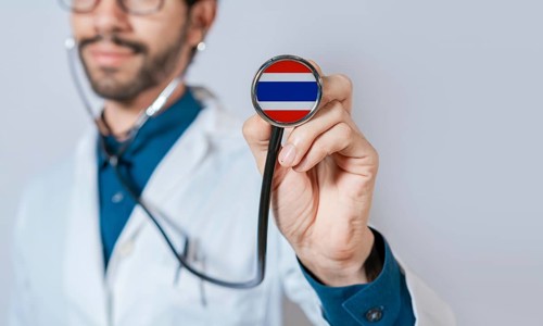 Doctor holding stethoscope with Thailand flag. Thailand health and care concept, Thailand flag on