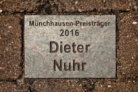 Sign for the 2016 Münchhausen Prize winner Dieter Nuhr in the Münchhausen town of Bodenwerder,