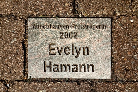 Sign for the 2002 Münchhausen Prize winner Evelyn Hamann in the Münchhausen town of Bodenwerder,
