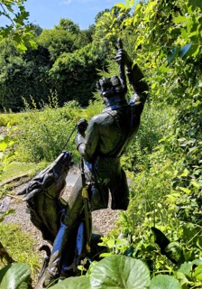 Statue of the swamp scene Pulling yourself out of the swamp by your own bootstraps in the