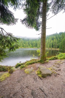 A lake surrounded by forests and mist offers a peaceful atmosphere, Mummelsee, Seebach, Ortenau