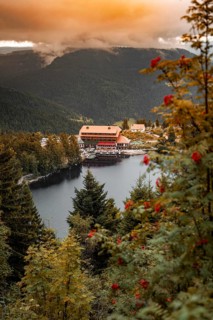 Romantic view of a lake surrounded by wooded mountains in the evening, Mummelsee, Seebach, Ortenau