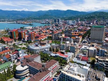 Urban environment with densely built-up areas and mountain backdrop, aerial view, Batumi, Black