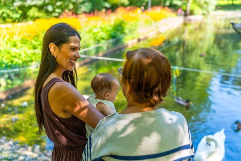Three generations of a latin family, grandmother, mother, and baby granddaughter, spending quality