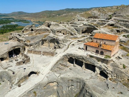 Architecture of the ancient cave city of Uplistsikhe with ruins and spectacular rock panorama,