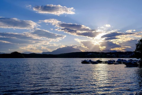 Sunset at the lake near Neuegg am Faaker See, behind Dobratsch, Carinthia, Austria