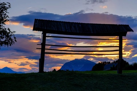 Sunset, hayrack, hayrack, at the ruins of Finkenstein Castle, on Lake Faak, Carinthia, Austria