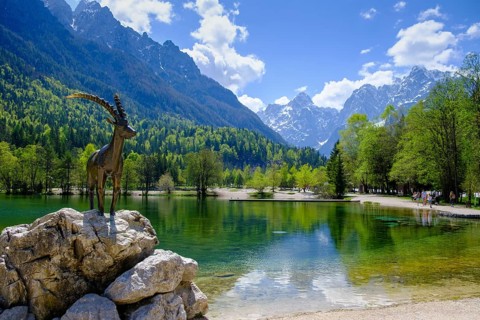 Ibex sculpture at Jasna Lake in Triglav National Park, Kranjska Gora, Upper Carniola, Julian Alps,
