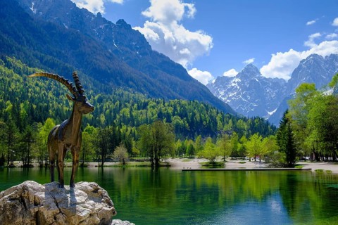 Ibex sculpture at Jasna Lake in Triglav National Park, Kranjska Gora, Upper Carniola, Julian Alps,