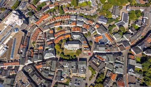 Aerial view, circular residential complex in the city centre with evang. Erlöserkirche,