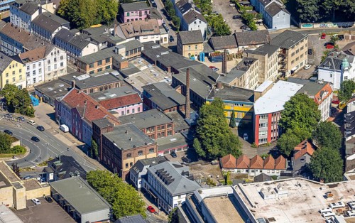 Aerial view, Haus der Gesundheit, former factory of the Berg company with chimney, now part of the