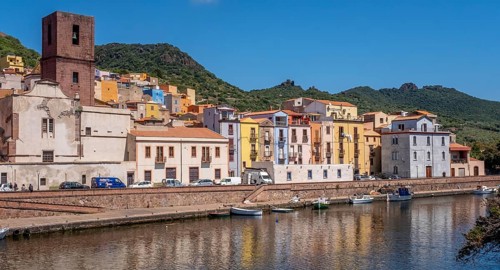 Sardinia, Town view, Residential houses on the river Temo and church tower, Bosa, Europe, Province