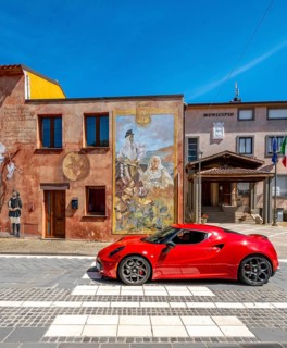 Sardinia, house with mural, Sardinia landmark, red sports car, Tinnura, Europe, Oristano province,