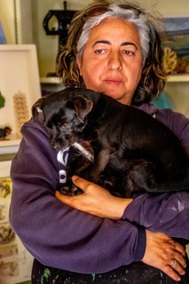 Sardinia, Pina Monne, portrait of woman and dog on arm, artist, Tinnura, Europe, Oristano province,