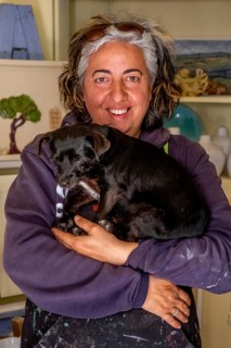 Sardinia, Pina Monne, female portrait and dog on arm, artist, Tinnura, Europe, Oristano province,