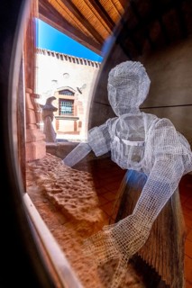 Sardinia, woman as grid model in the museum at work, Fordongianus, Europe, Province of Oristano,