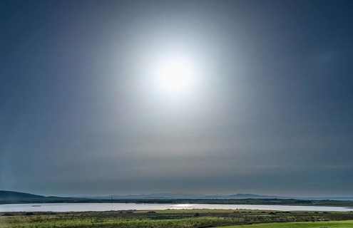 Sardinia, backlight sun over a lake and blue sky, Tharros, Europe, Province of Oristano, Italy,