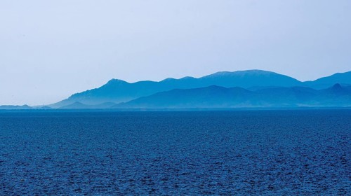 Sardinia, sea and mountains dipped in blue colour, Tharros, Europe, Province of Oristano, Italy,