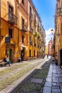 Sardinia, tourists in a pedestrian zone with picturesque house fronts, Bosa, Europe, Province of