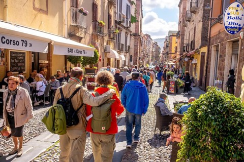 Sardinia, tourists in a pedestrian zone, stroll of tourists on a shopping street, Bosa, Europe,