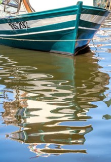 Sardinia, front of a fishing boat with reflection in the river Temo, Bosa, Europe, Province of