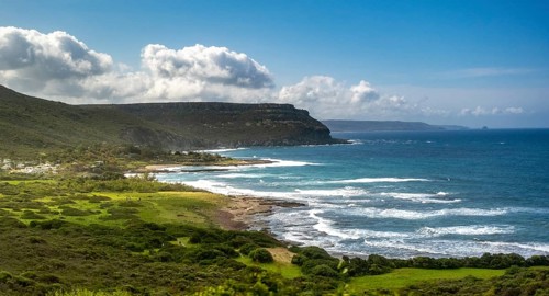 Sardinia, mountainous coastal landscape by the sea, blue sky with clouds, Bosa, Europe, Province of