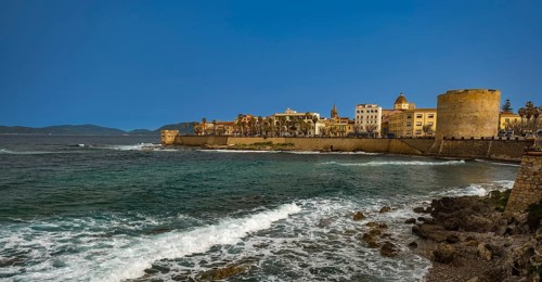 Sardinia, coastal wall, coast and beach, city wall and tower Torre San Giacomo, Torre di Sulis o de
