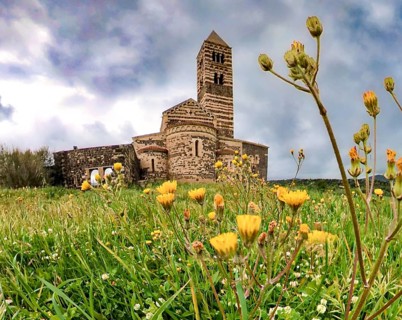 Sardinia, The Abbey Church of Santissima TrinitÃƒÂ di Saccargia, Romanesque church, flower meadow,