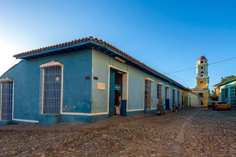 Blue tourist shop in front of the church Convento de San Francisco de Asis, Trinidad, Cuba, Sancti