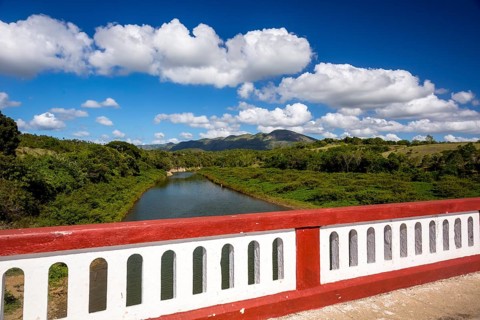 River with red bridge area between Santa Clara and Trinidad Valley of Ingenios, Valle de los