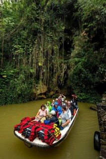 Exit of the cave system, tourists in an electric boat with life jackets, caves of the Indios, Cueva