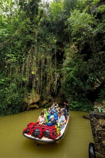 Exit of the cave system, tourists in an electric boat with life jackets, caves of the Indios, Cueva