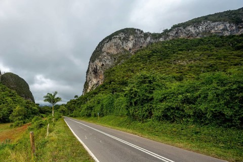 Country road with central reservation in the Vinales Valley, Viñales, Cuba, Pinar del Río, Cuba