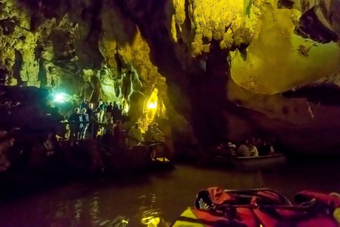 Tourists in a boat on the underground rivers in the caves of the Indios, Cueva del Indio,
