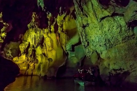 Tourists in a boat on the underground rivers in the caves of the Indios, Cueva del Indio,